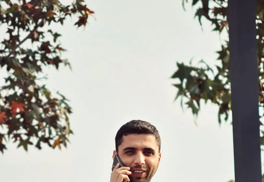 A tradesperson taking a call on site